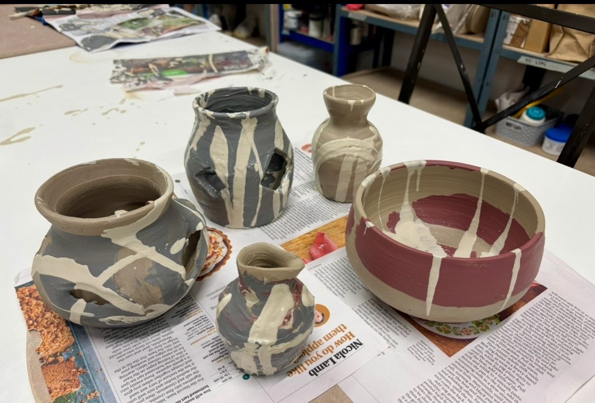 Ceramic vessels with black, brown and white slip