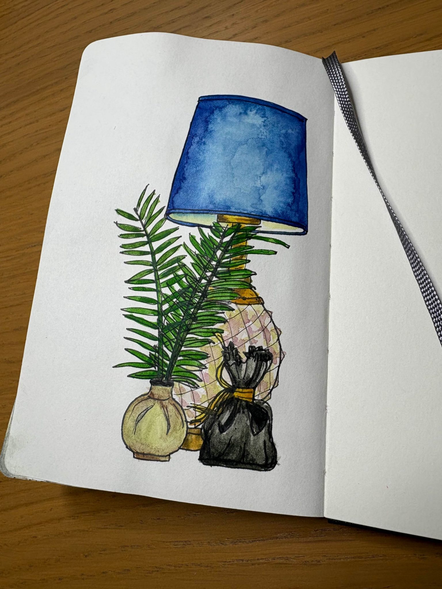 Watercolour painting of blue lamp, fern and bag of lavender