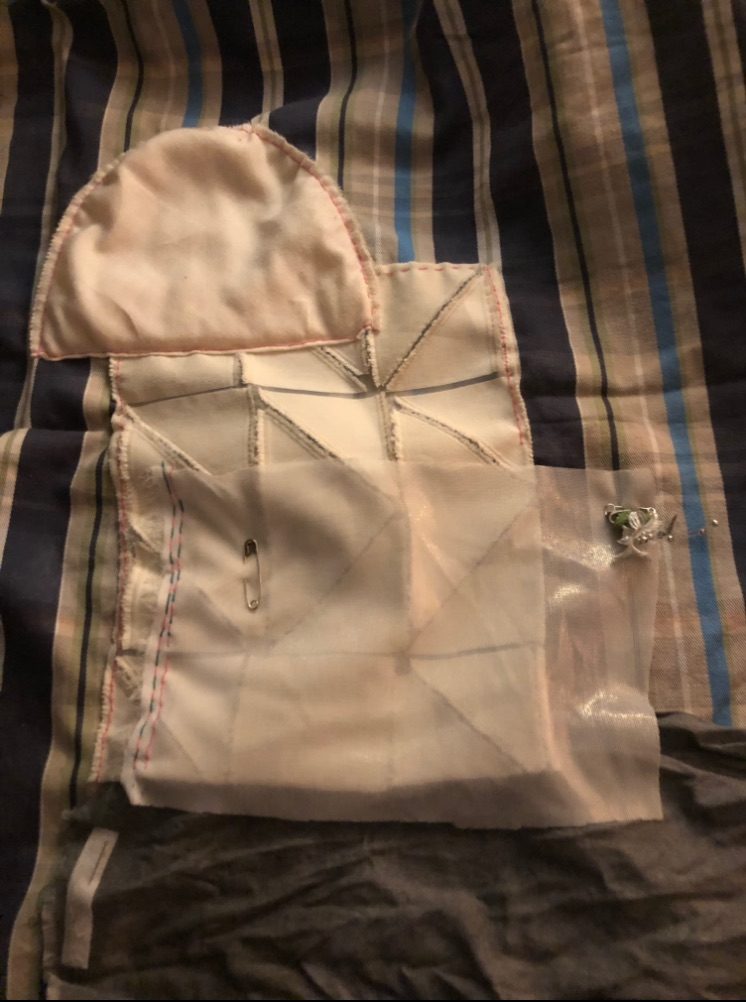 making in low light is almost blindness. stitching of scrap fabric and free online curtain sample and found object