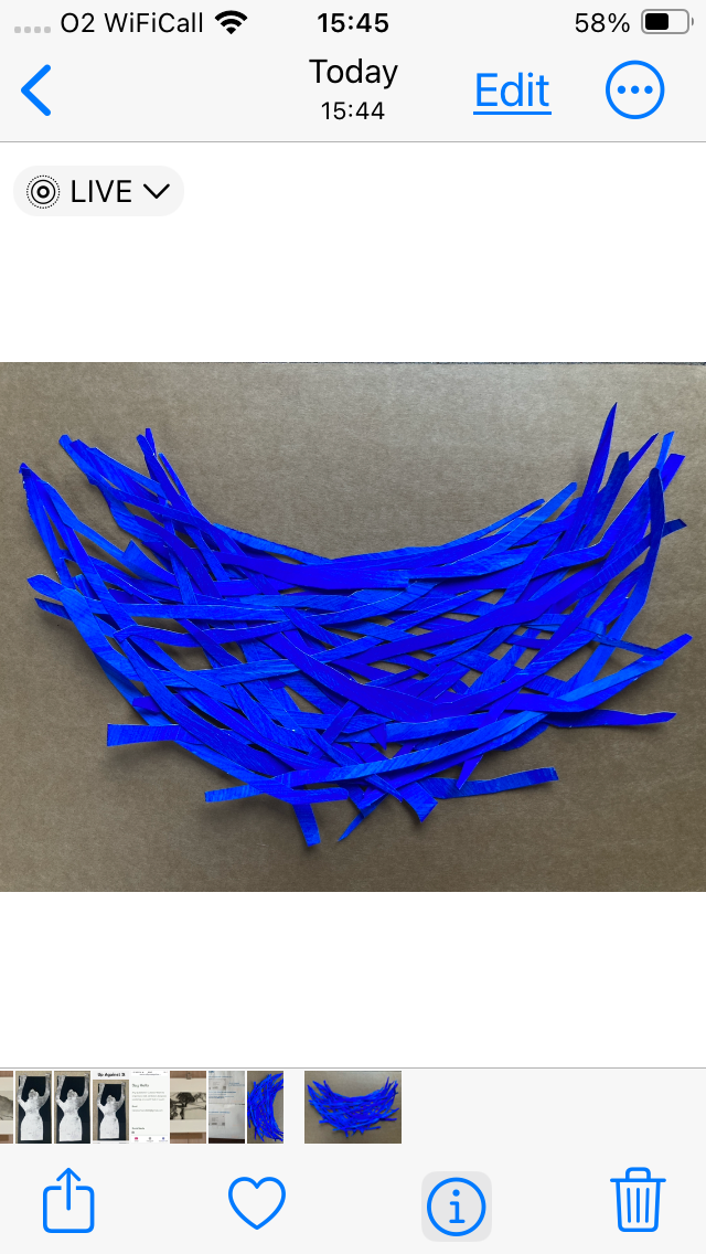 Birds nest from strips of painted blue paper
