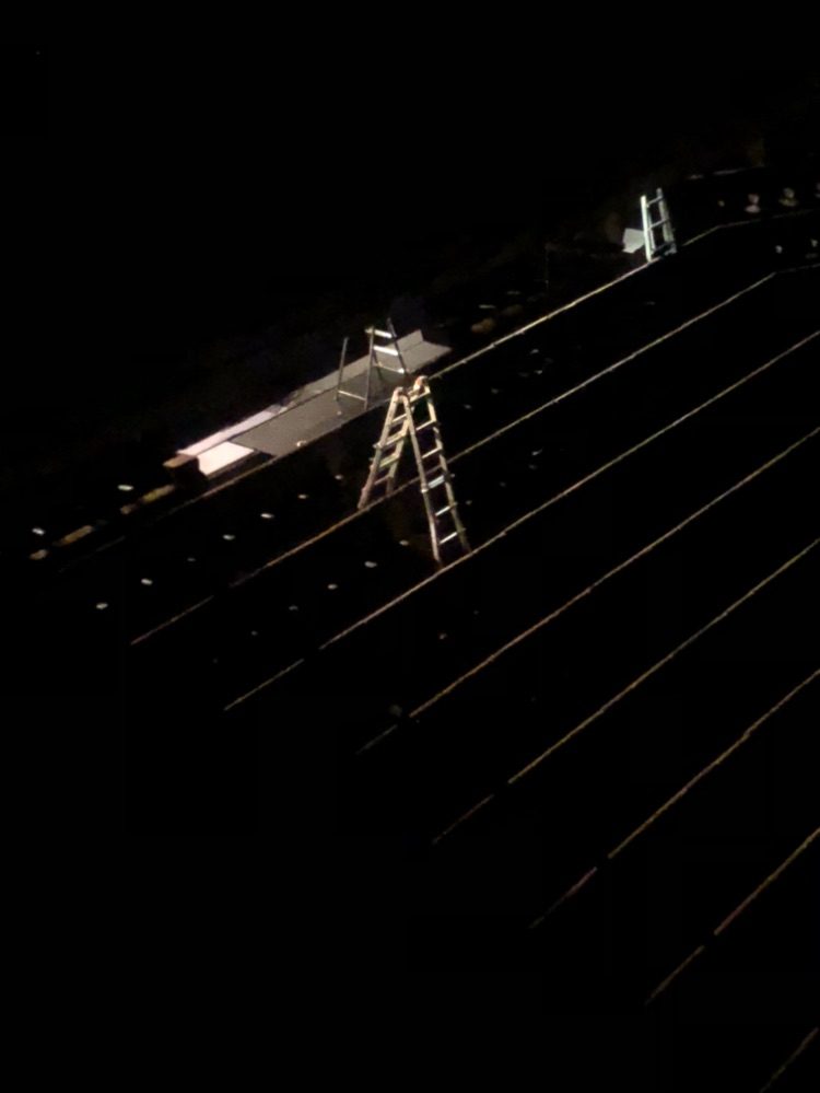 ladders on a dark construction site