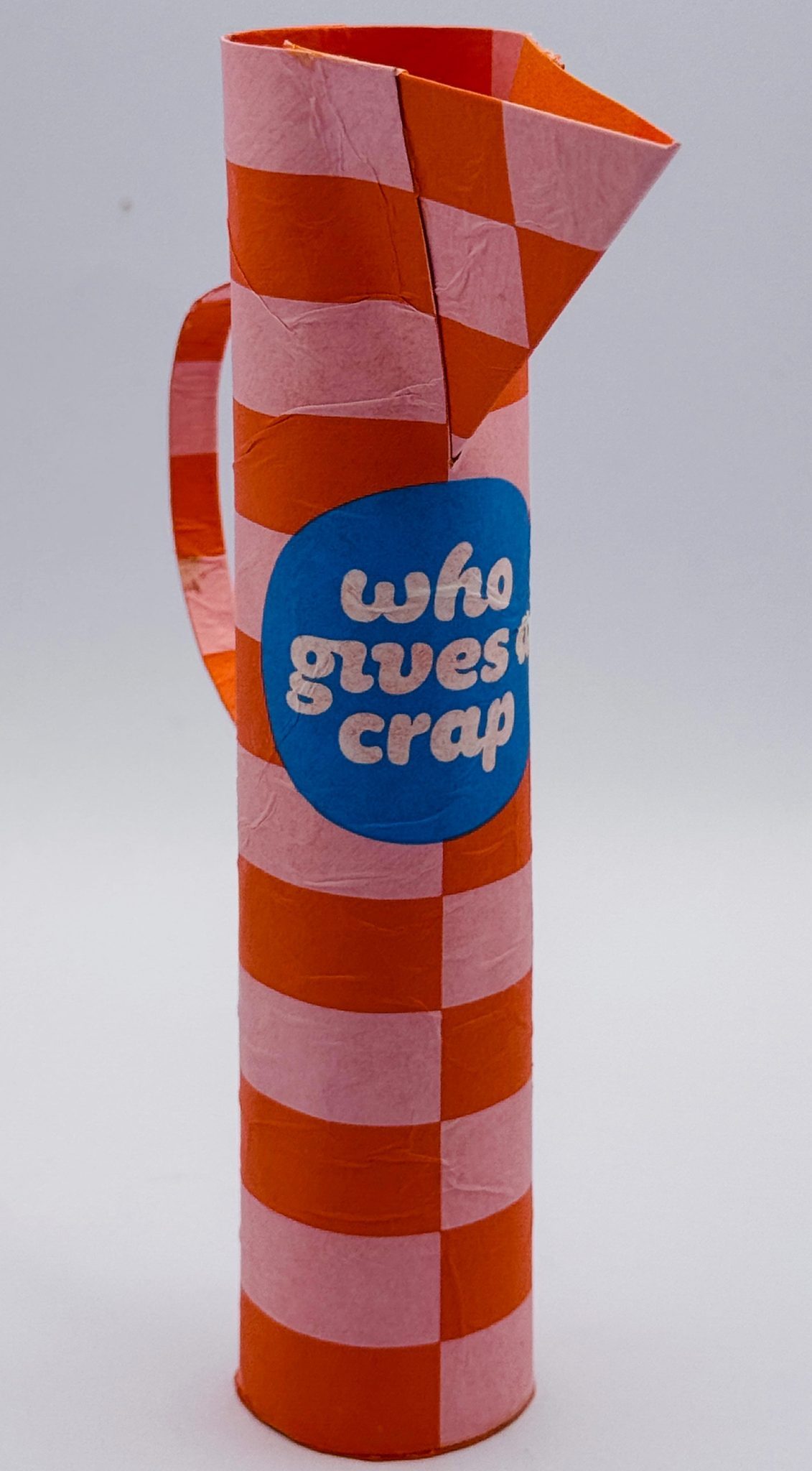 Small jug made from outer toilet paper wrapping.