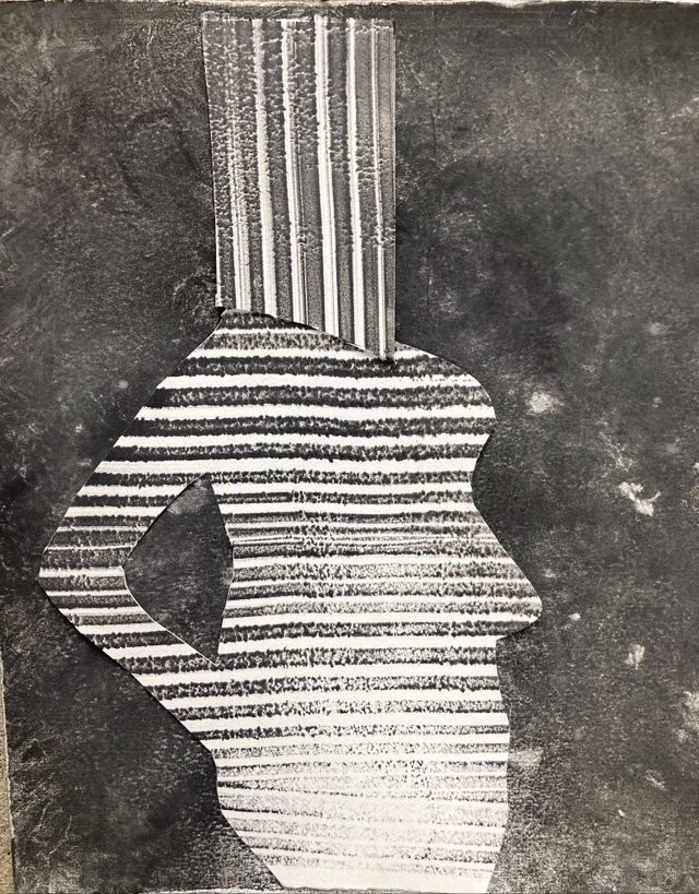 Printed paper cut out , woman with bag on her head