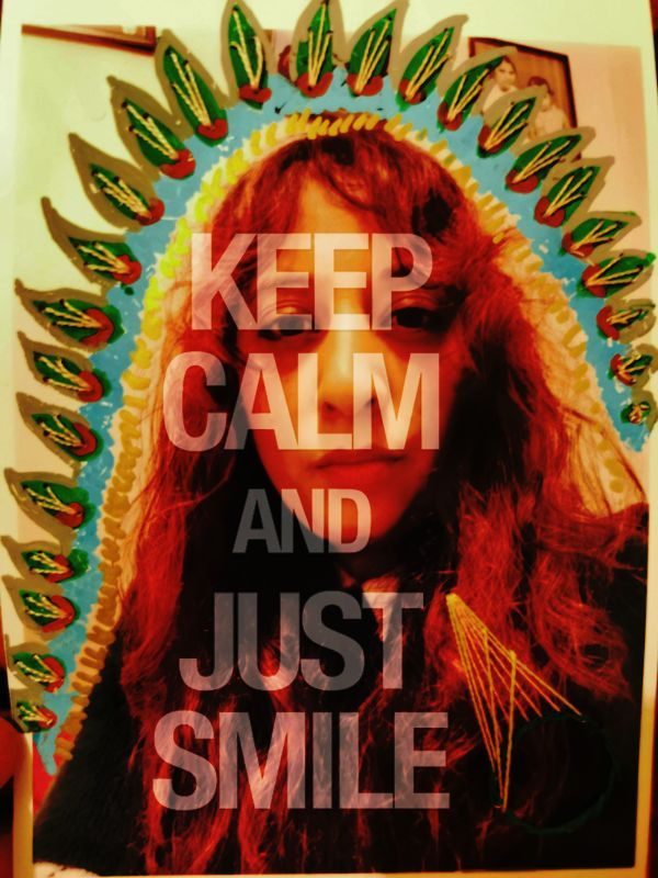 Double exposure of the same image, with text Keep calm and smile. Photograph has painted and embroidered on, with what looks like a colourful crown and geometric shapes.
