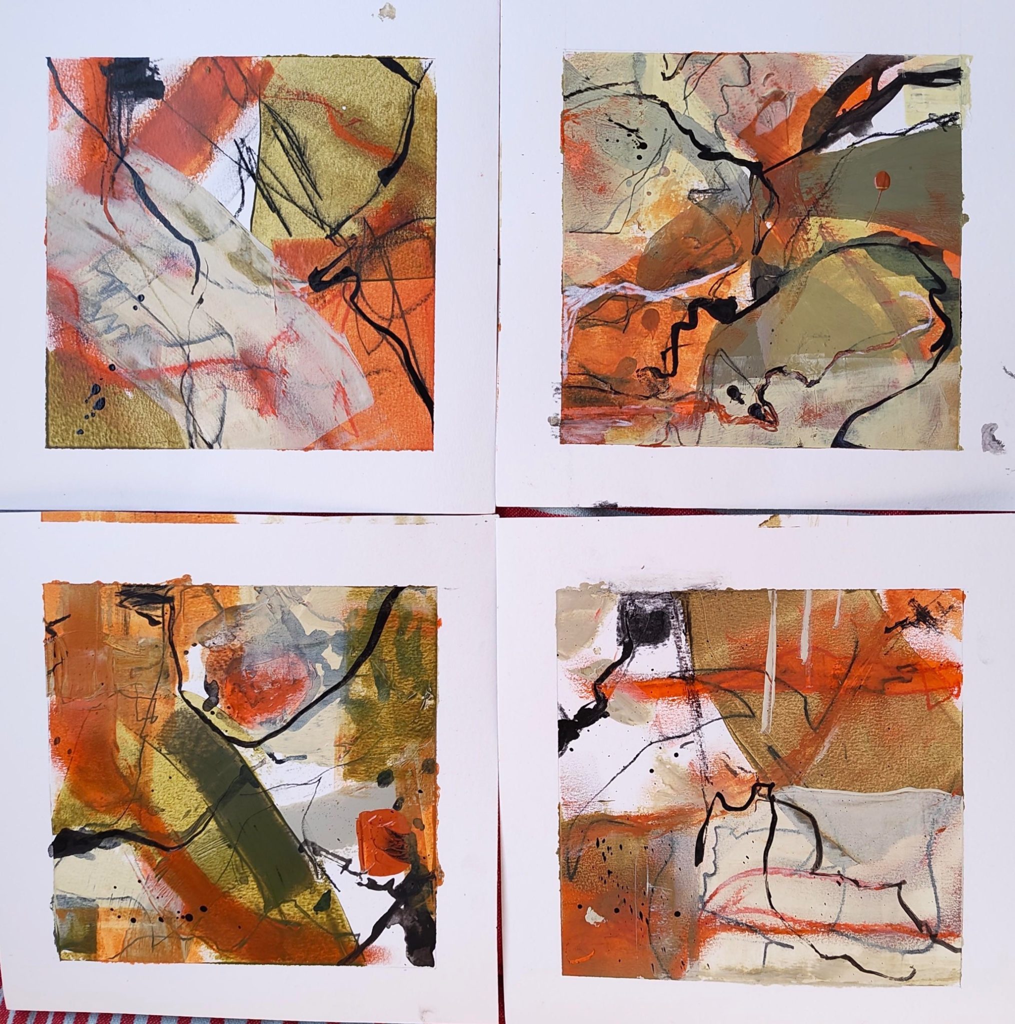 4 small abstract mixed media paintings, colours black, white and tones of orange and green.
