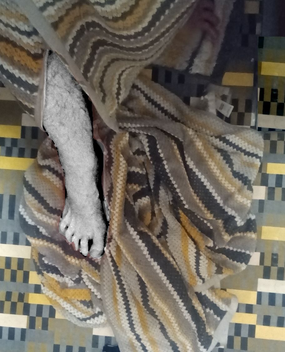 bathroom floor with foot and towels