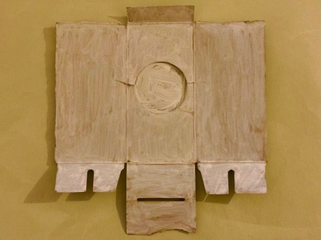 back of a cat litter bag packet, streaky white