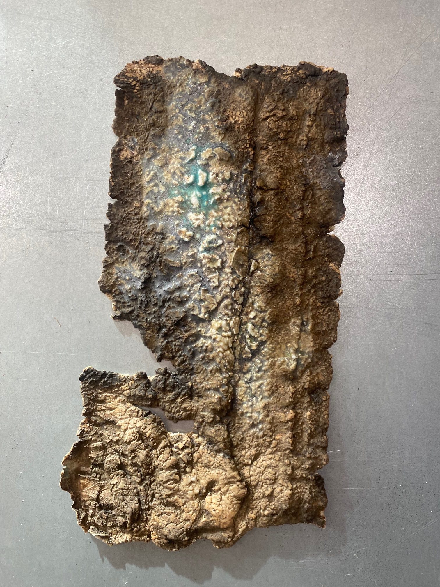 Heavily textured porcelain, layered with glazes