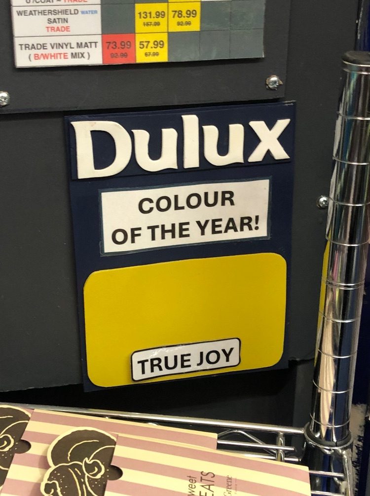 a swatch seen in a paint shop- Dulux colour of the year “True Joy”, a sort of yellow