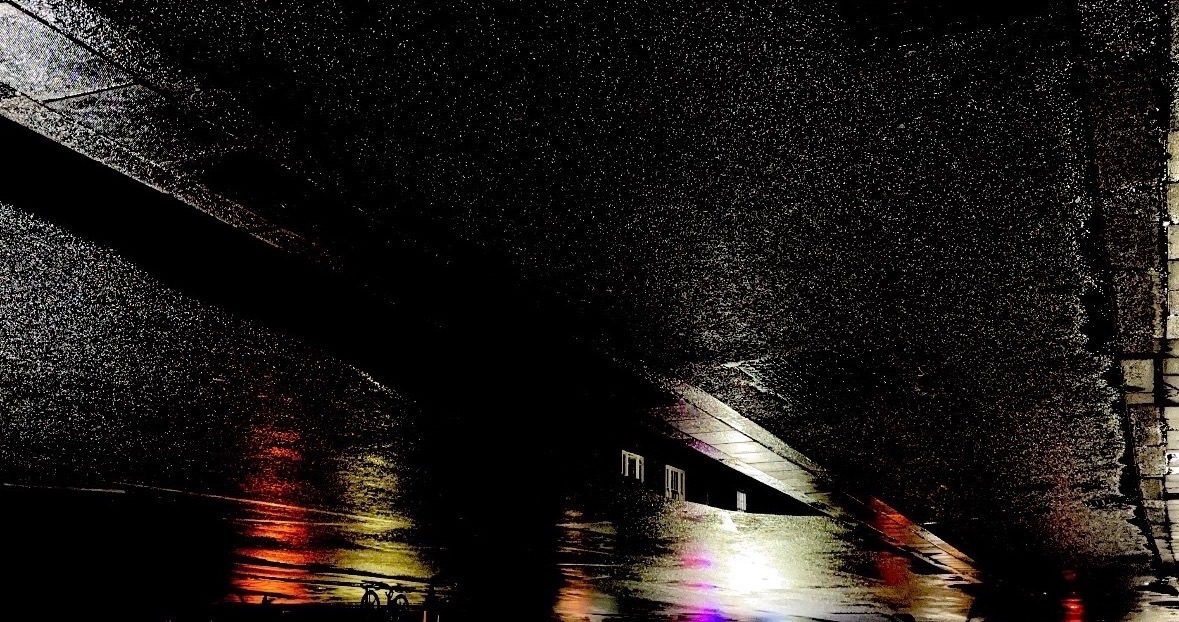 Flipped images of the rain creating light reflections on the paths