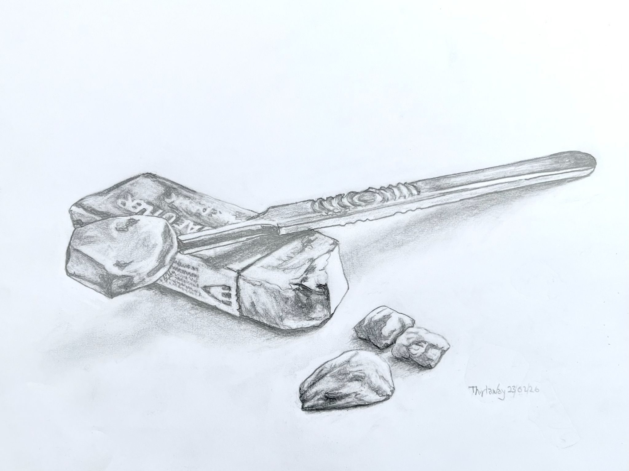 Pencil drawing of eraser, scalpel and pieces of eraser