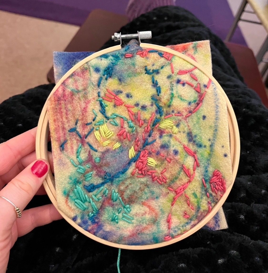 Embroidered colours on a colourful piece of felt