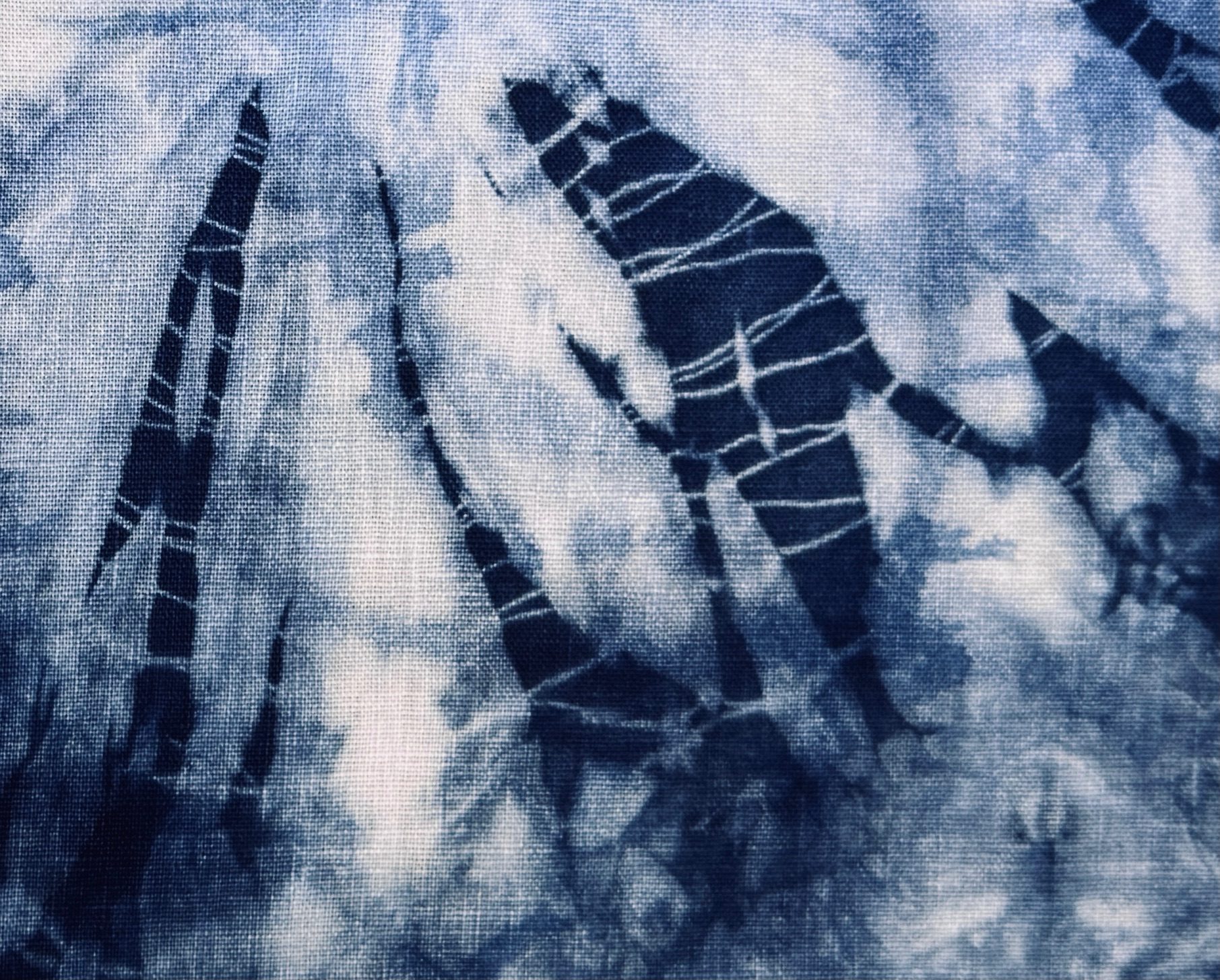 Adding more layers to an old piece of indigo dyed linen.
