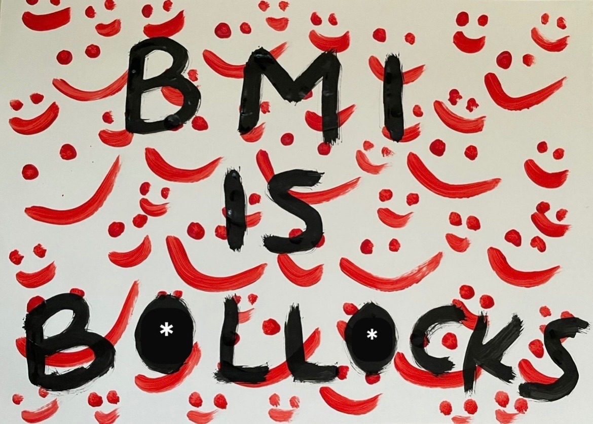 Painted landscape image. The background has lots of messy red smiley faces. The foreground painted in red letters reads “BMI is b*ll*cks’