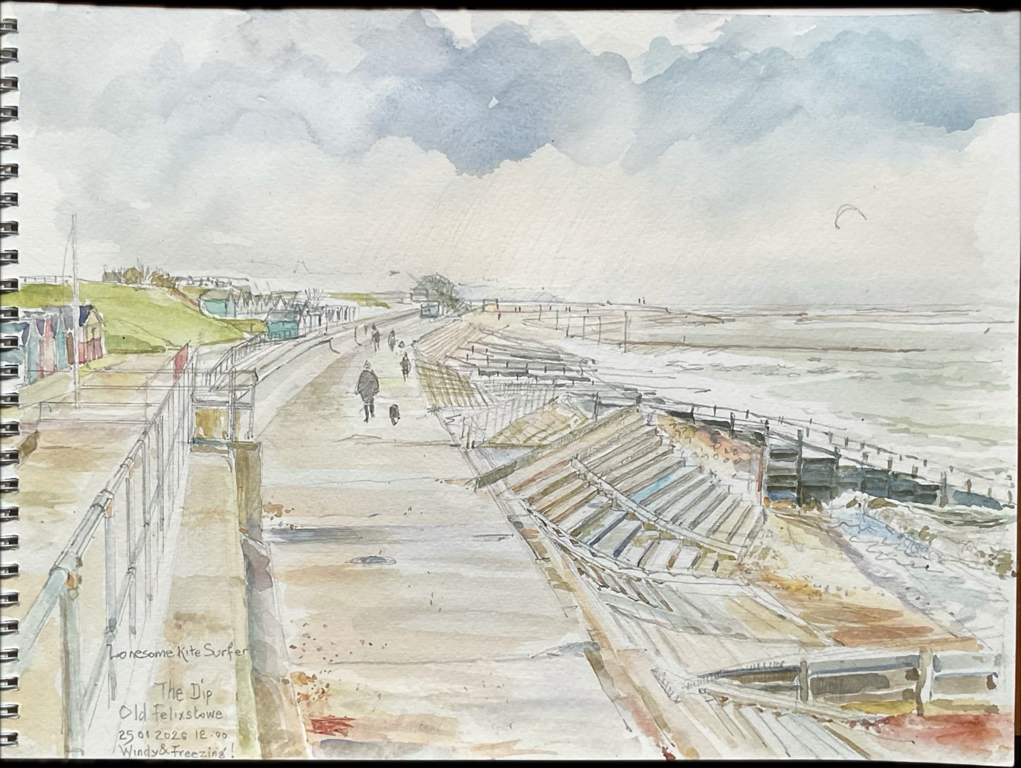 A lone kite surfer is practising their skill whilst dog walkers trudge up and down the promenade in the freezing cold. Life on the East Coast !