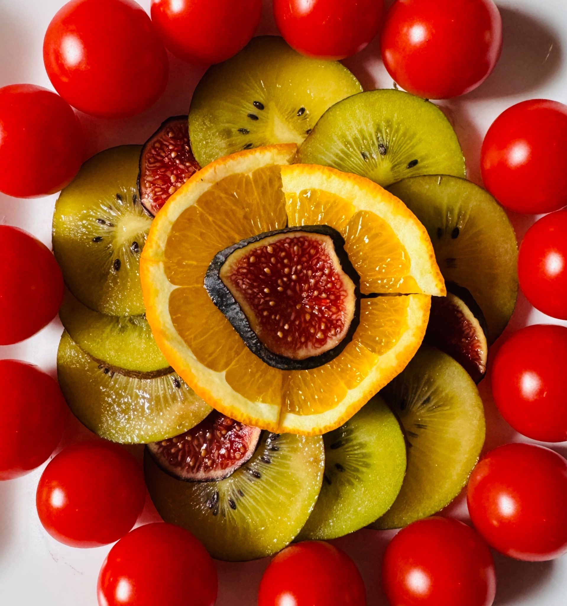 Orange, fig, Kiwi and cherry tomatoes.