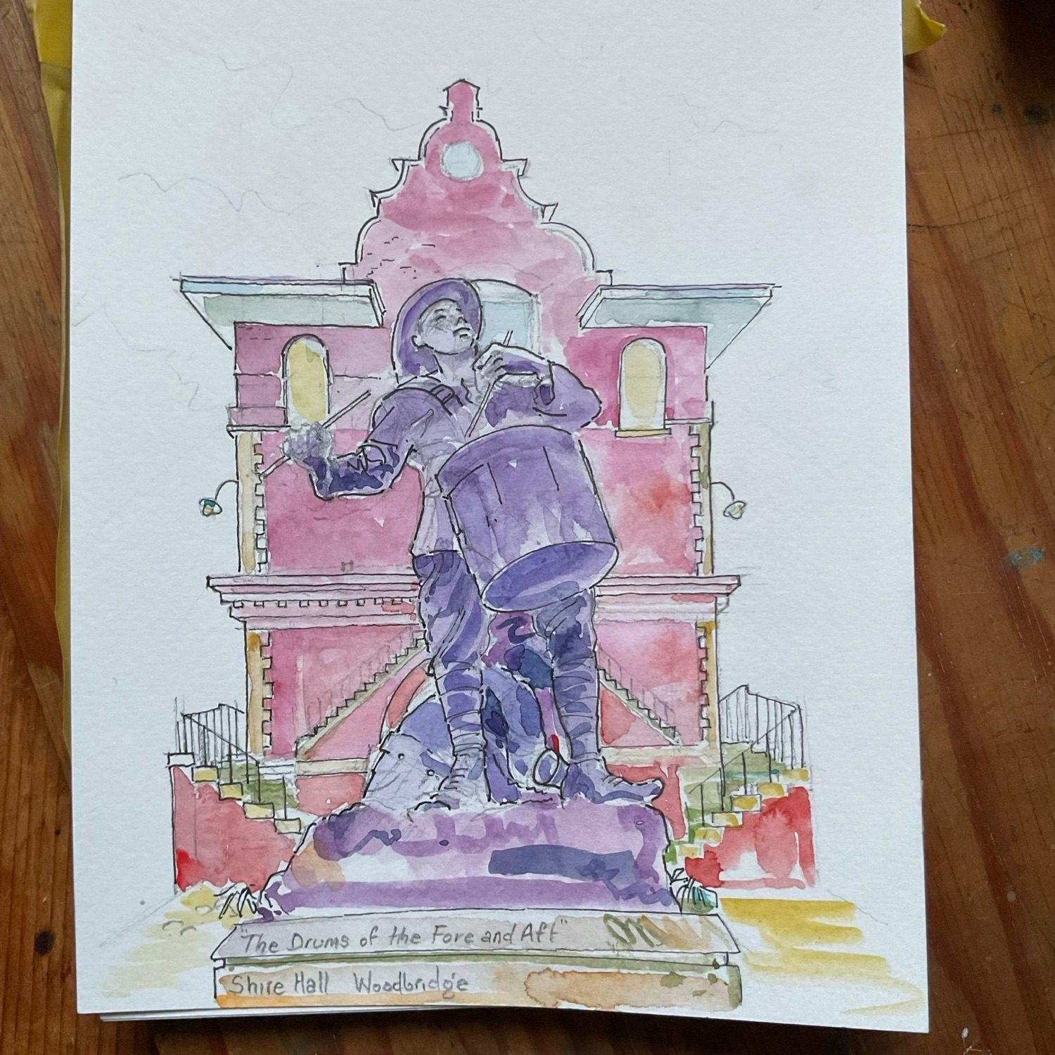 Watercolour sketch of a statue of a drummer boy and his comrade. The statue is outside the shire hall, an ancient building in Woodbridge Suffolk UK