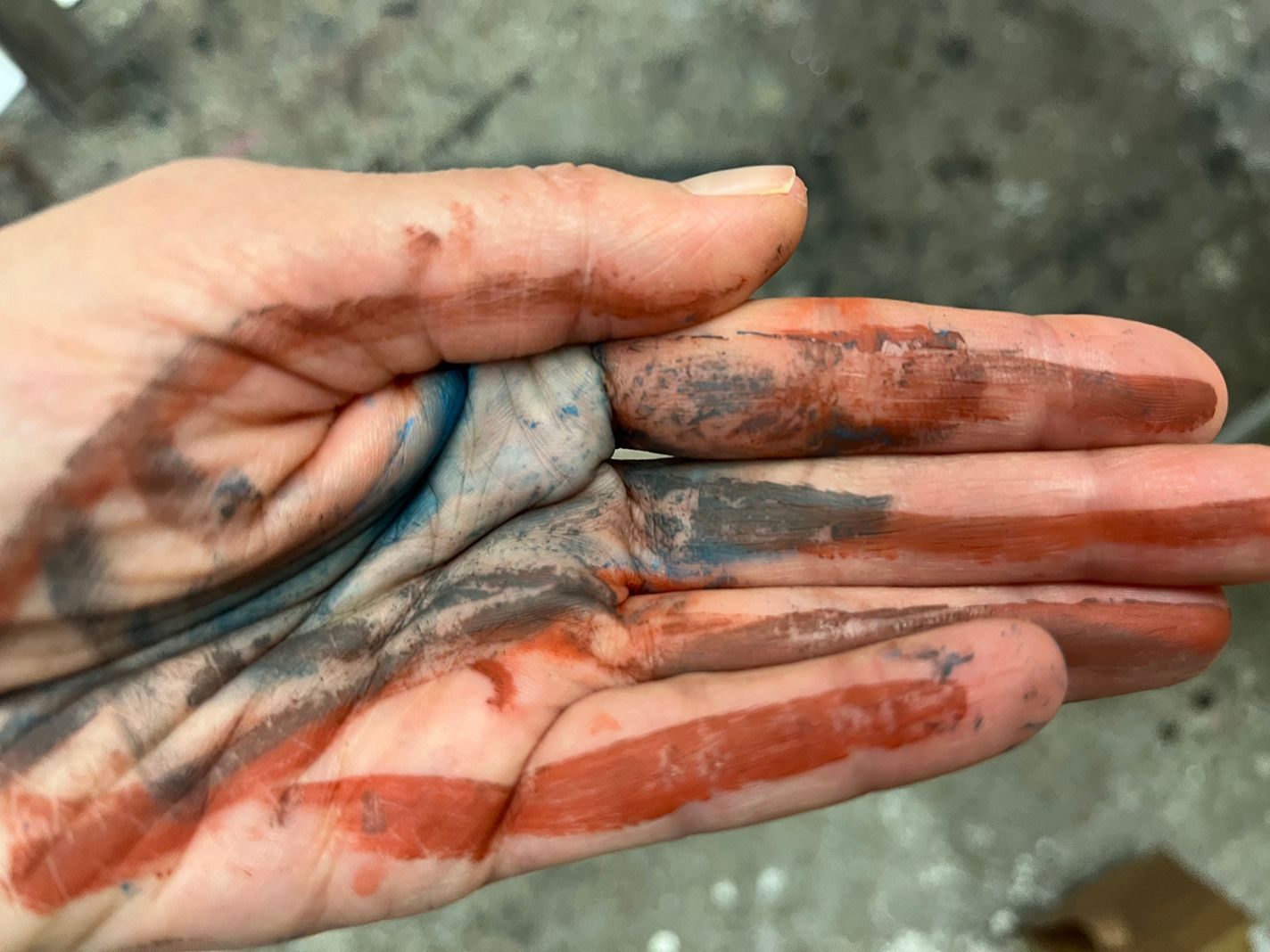 a hand covered with paint