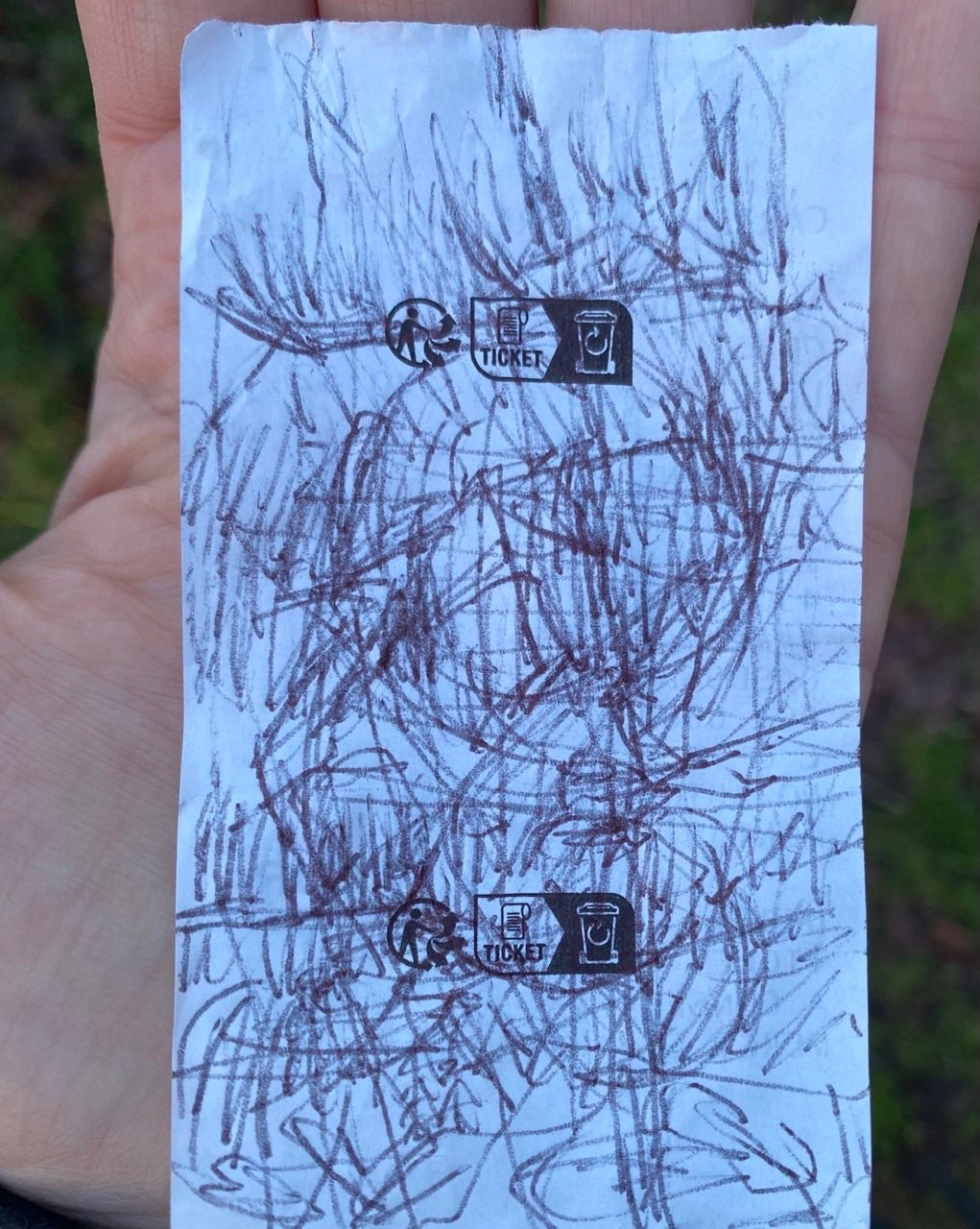 Drawing on the back of a receipt with broken biro whilst walking
