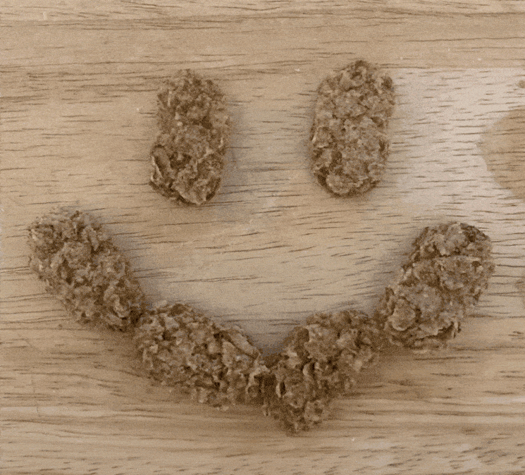 Gif of wheetabix minis in smiley face formation then in heart the disappearing one by one