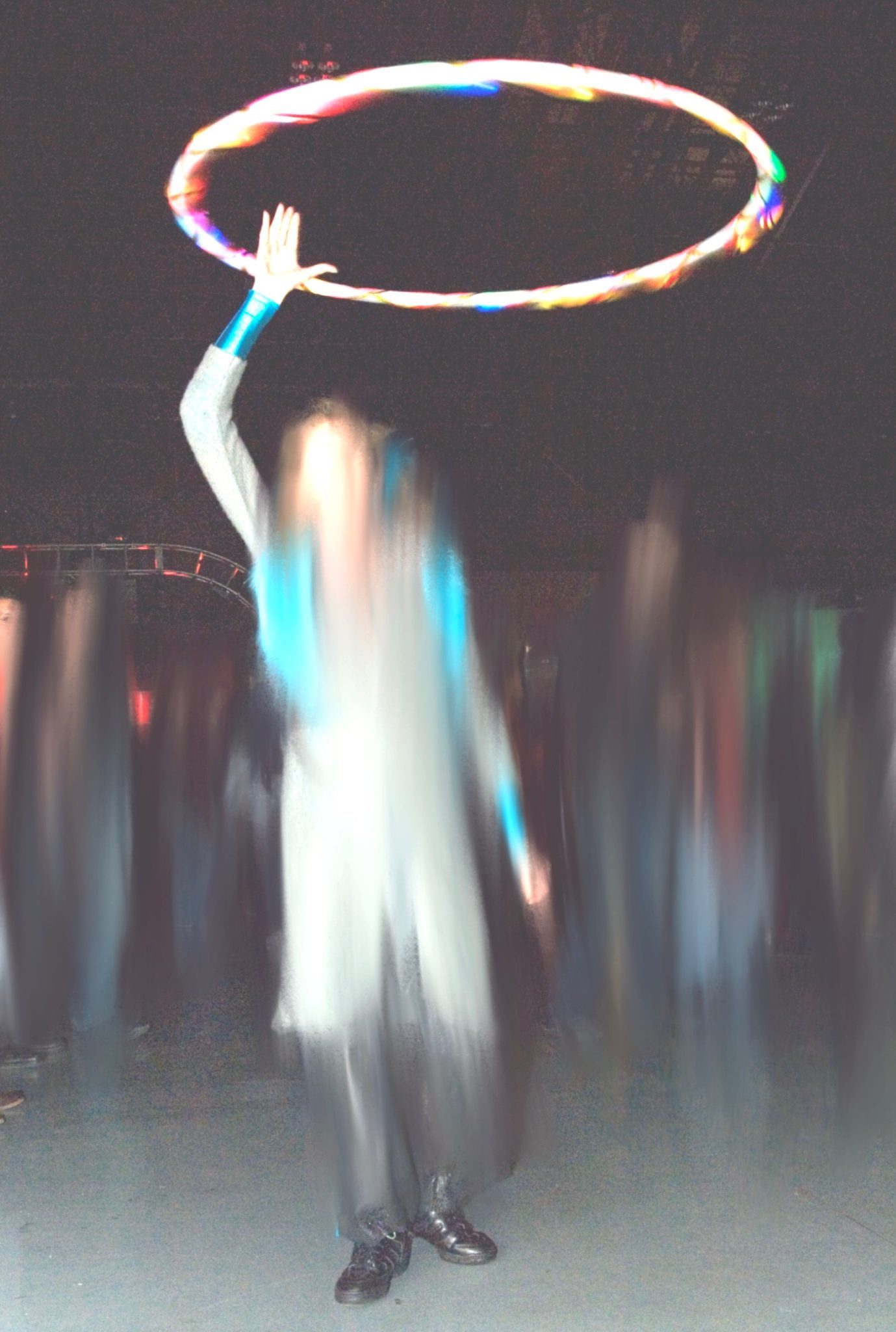 Girl spinning hoop above her head