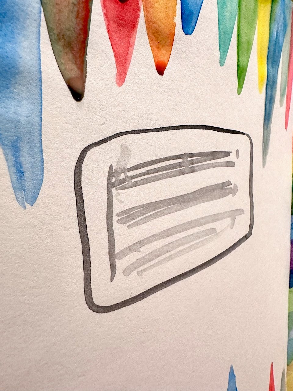 Watercolour sketch with still wet coloured triangles and the hint of a music stave