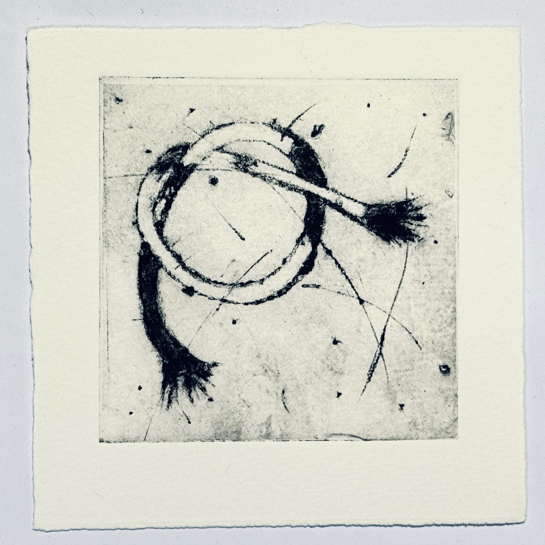 A drypoint print with chine collé of a simple knot in a piece of string