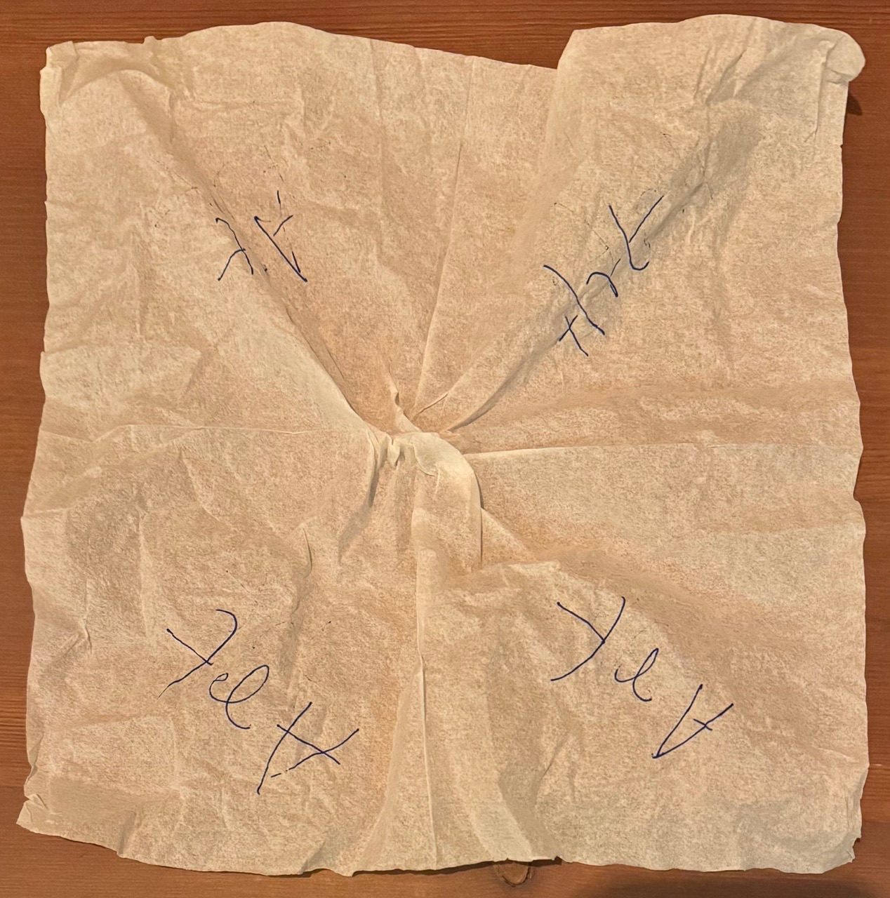 A napkin with art written on all four sides.