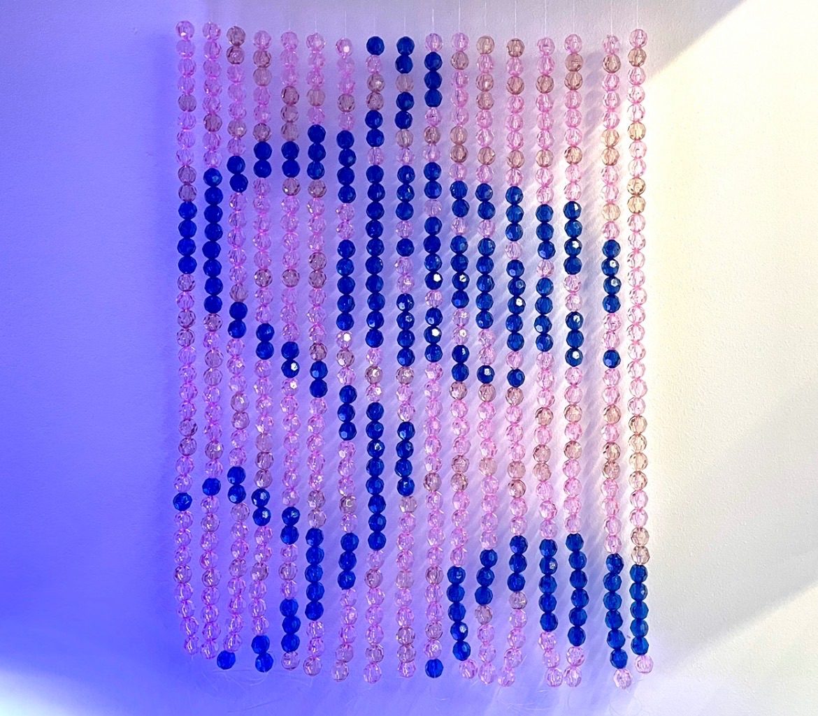 bead tapestry depicting the image of a drooping flower