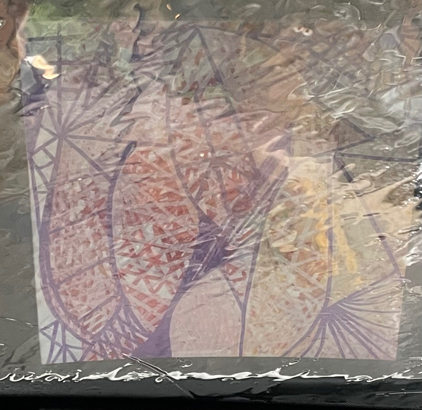 Reflection of painting in car window in the rain