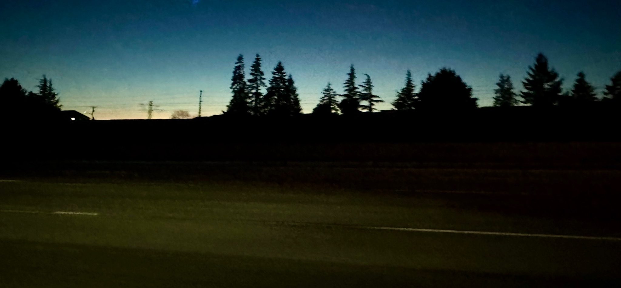 The world blurs while the sky stays still. This image captures the feeling of moving forward while mentally lingering in a moment that’s already fading.