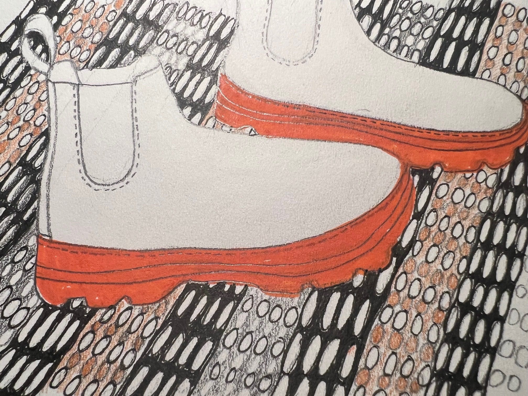 Outline drawing of boots on a patterned rug