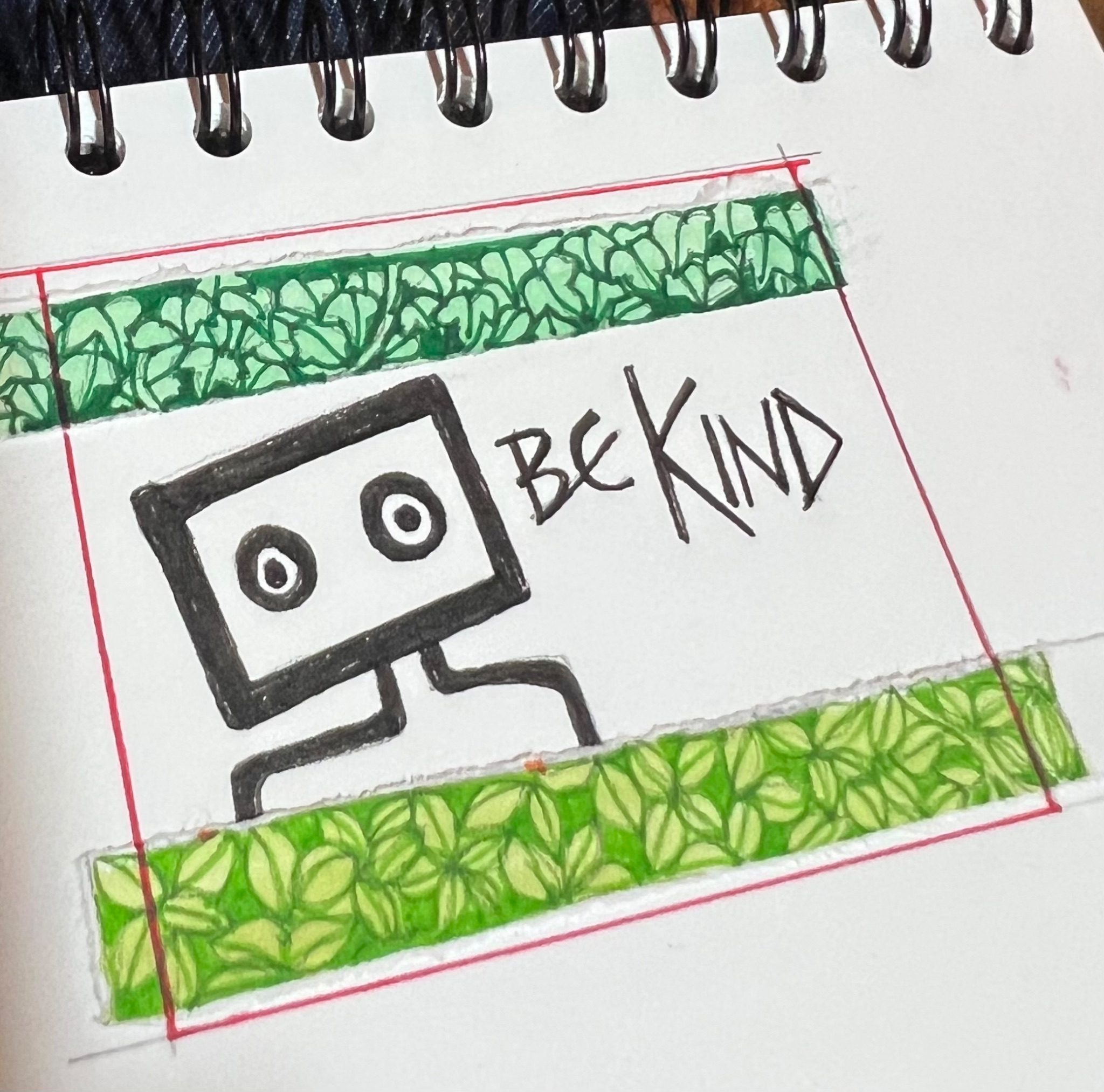 Sketch of graffiti “BE KIND” with top and bottom borders of drawn leaves