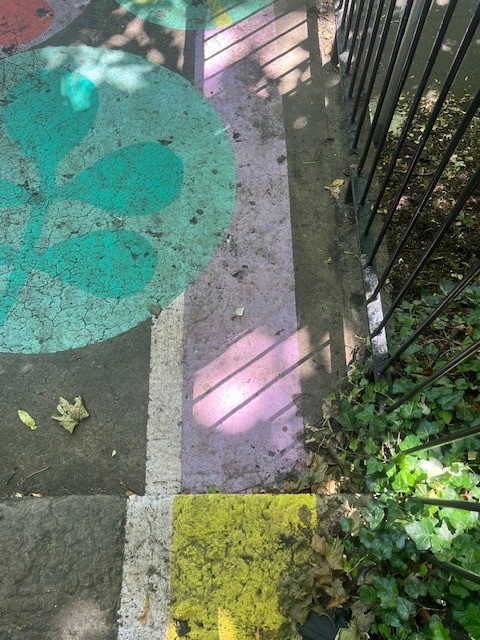 A photograph of painted steps and shadows