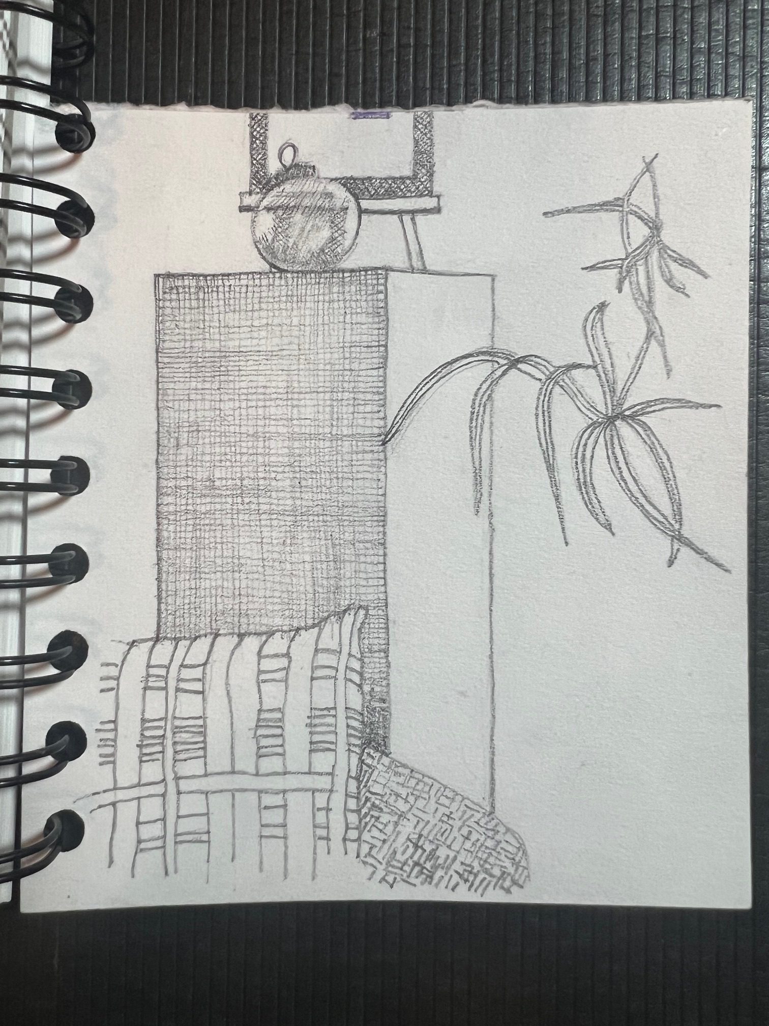 Pencil drawing of speaker with sofa and cushion in front