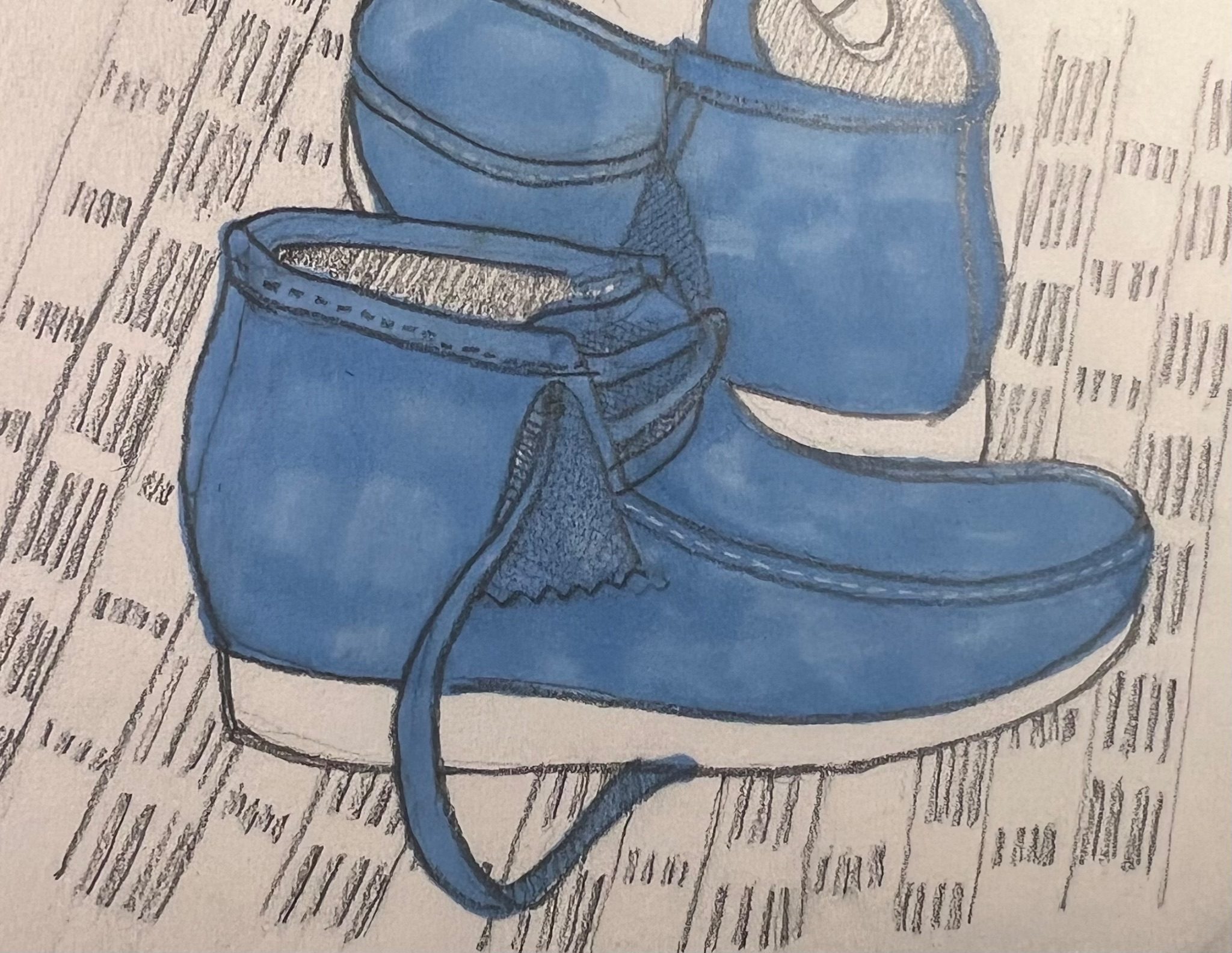 Drawing of boots on patterned rug using pencil and paintmarker