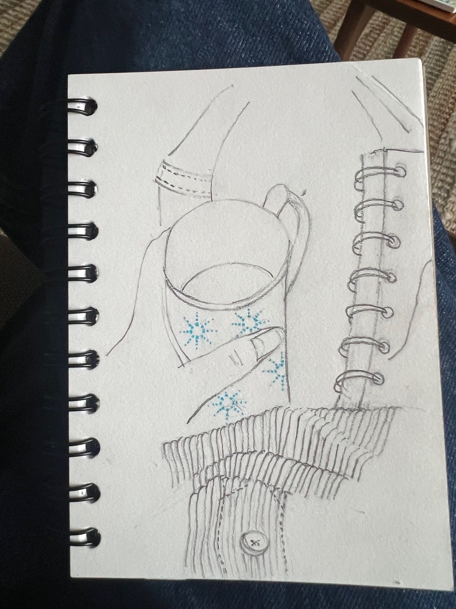 Pencil sketch of a hand holding a small mug of coffee