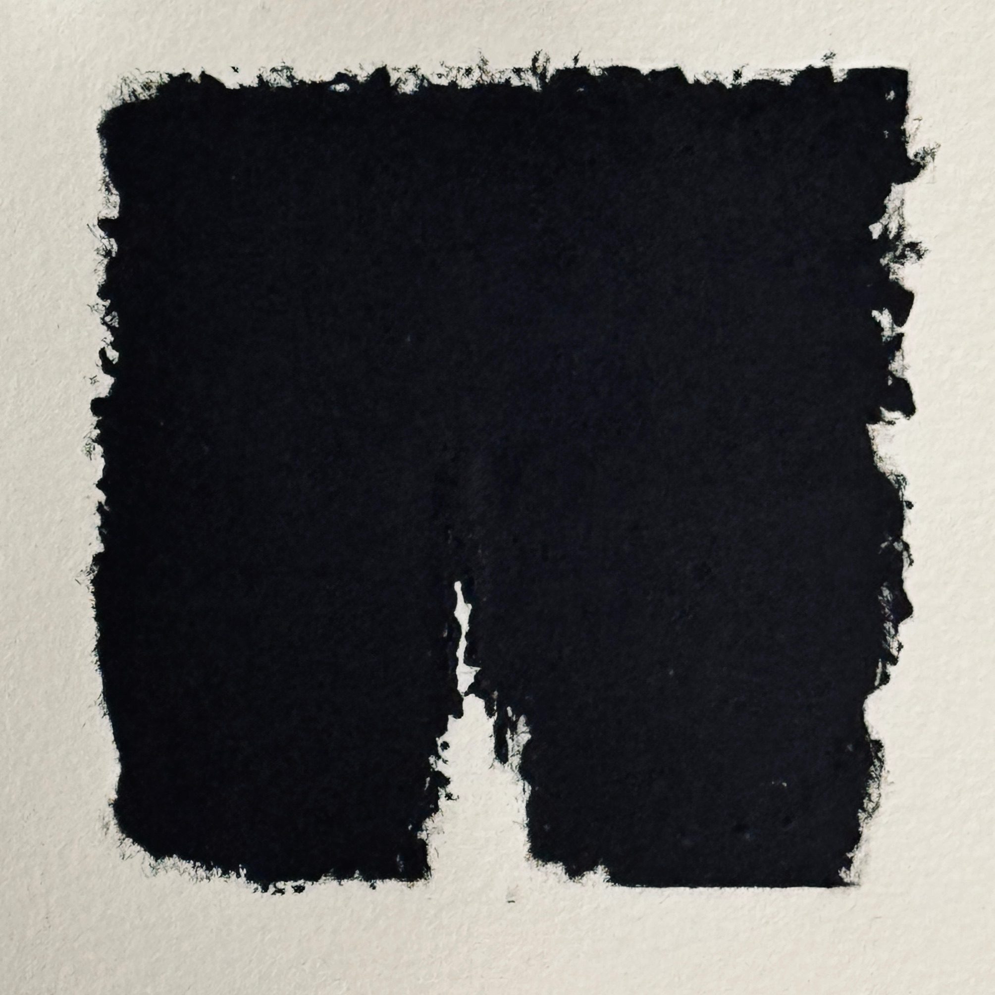 Relief print of torn cardboard square with ragged edges and a triangular tear