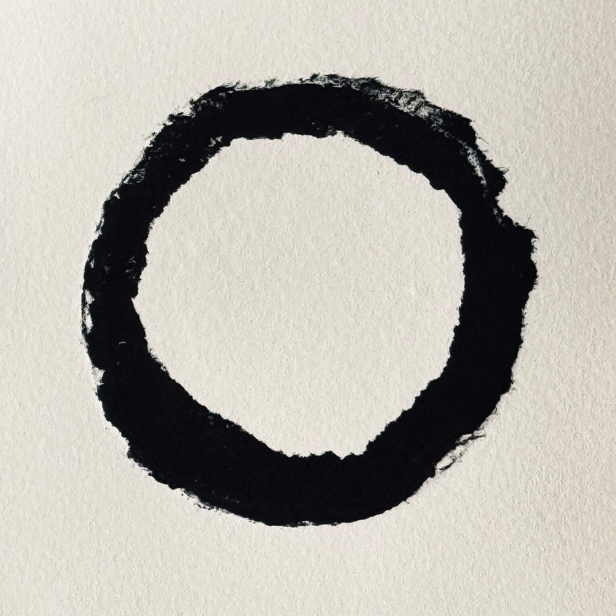 Relief print of a torn circle printed in black