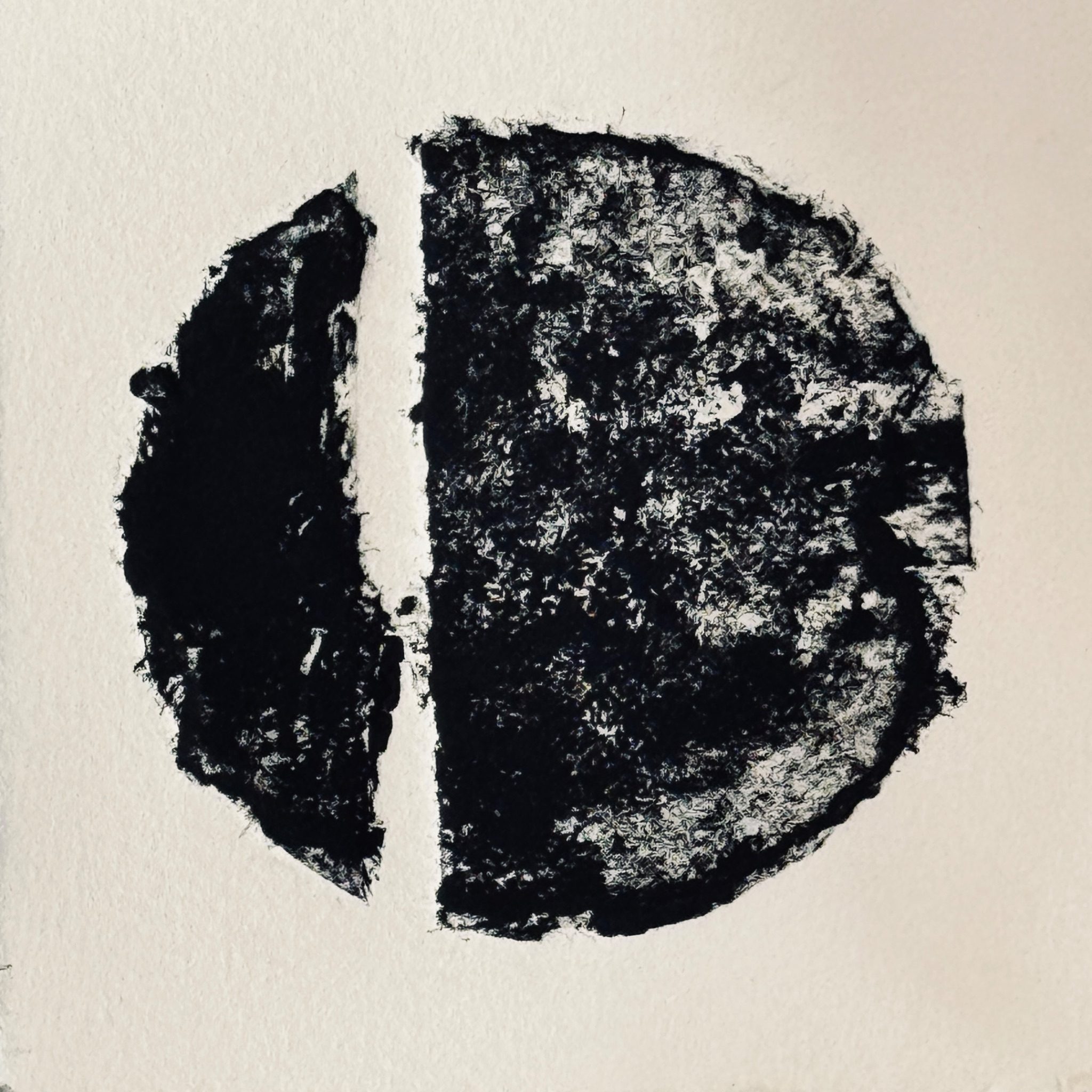 Relief print of a circle torn into two unequal halves