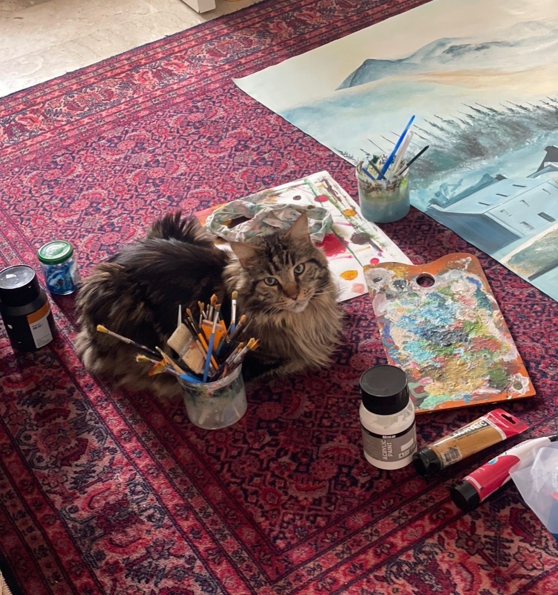 Diego the mansion loves to sit nearby and watch me paint
