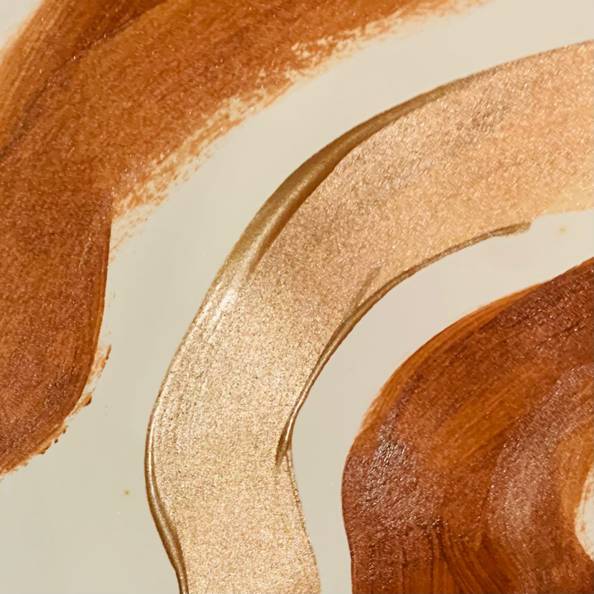 waves of bronze and brown acrylic paint