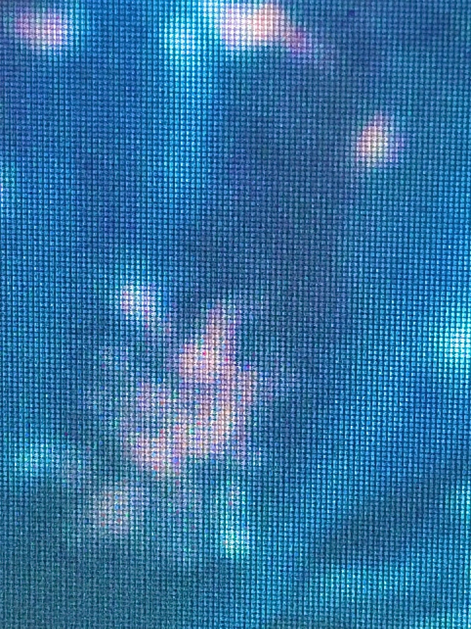 blue screen with white blurry shape