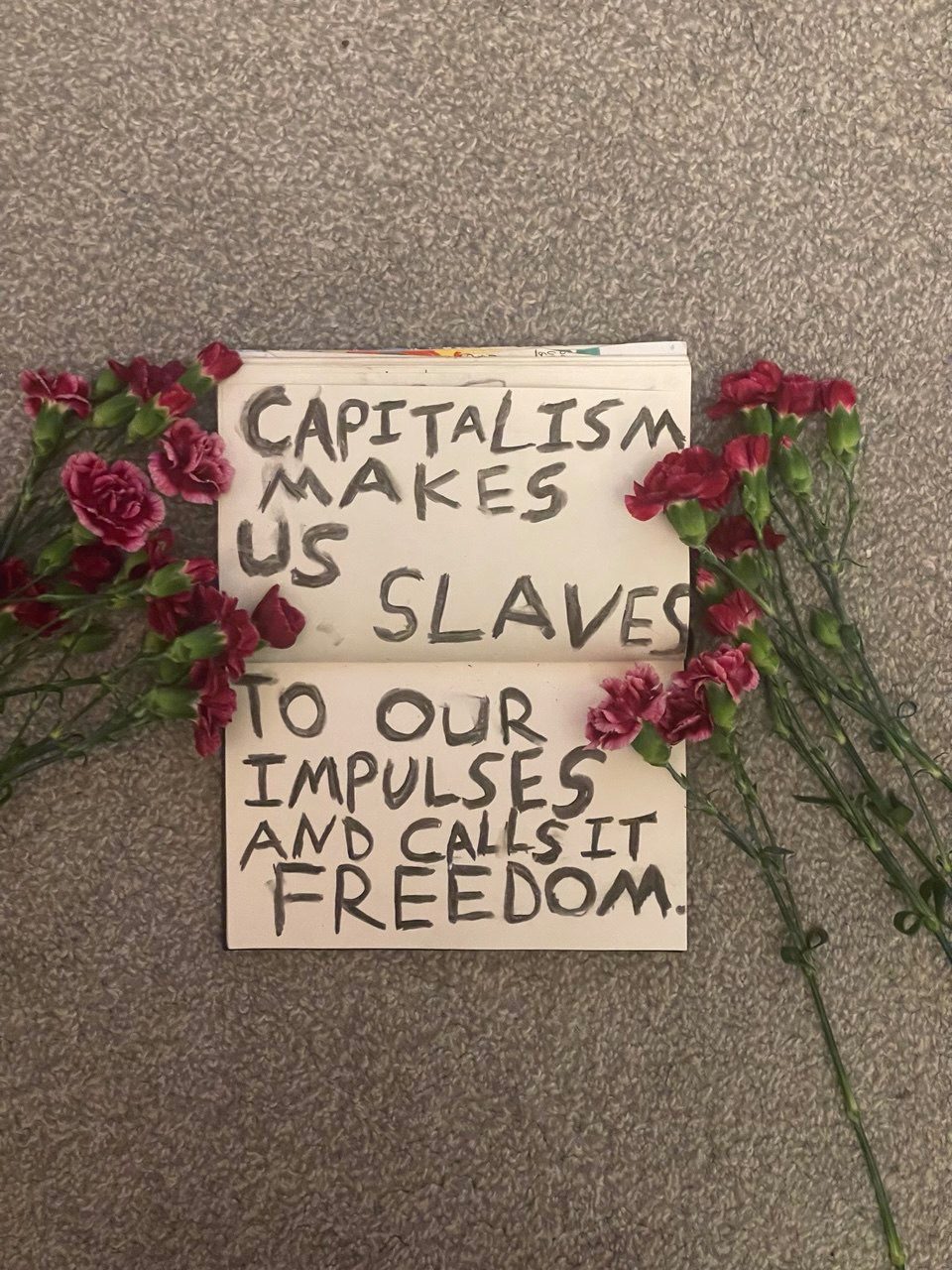 Charcoal text on a notebook with roses