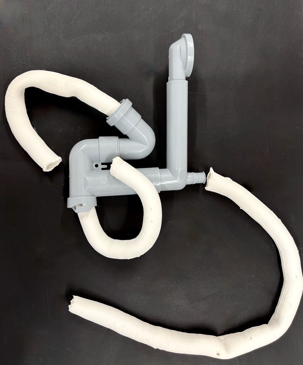 Plumbing pipes joined by ceeramic tubes