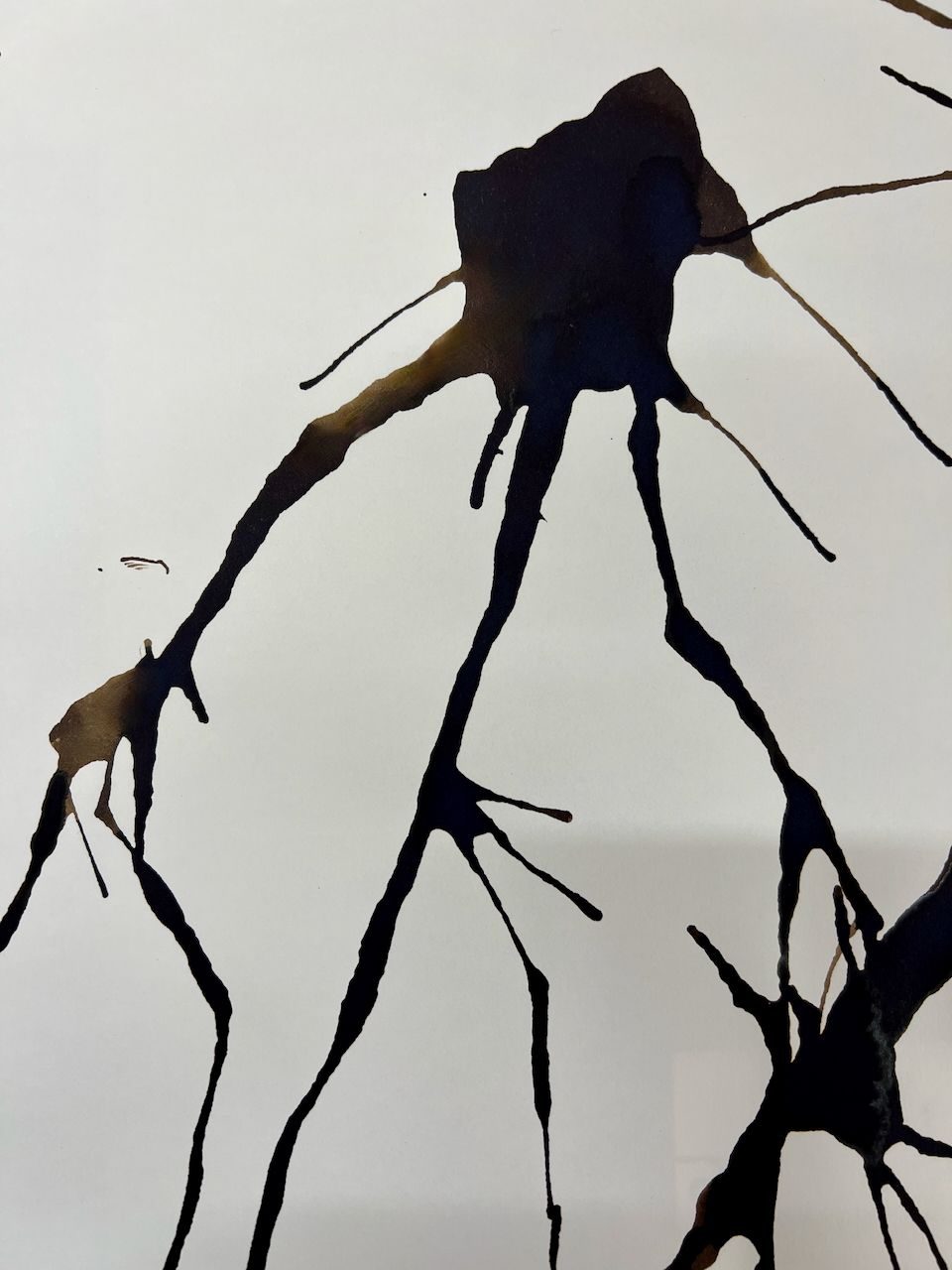 Black flowing ink marks