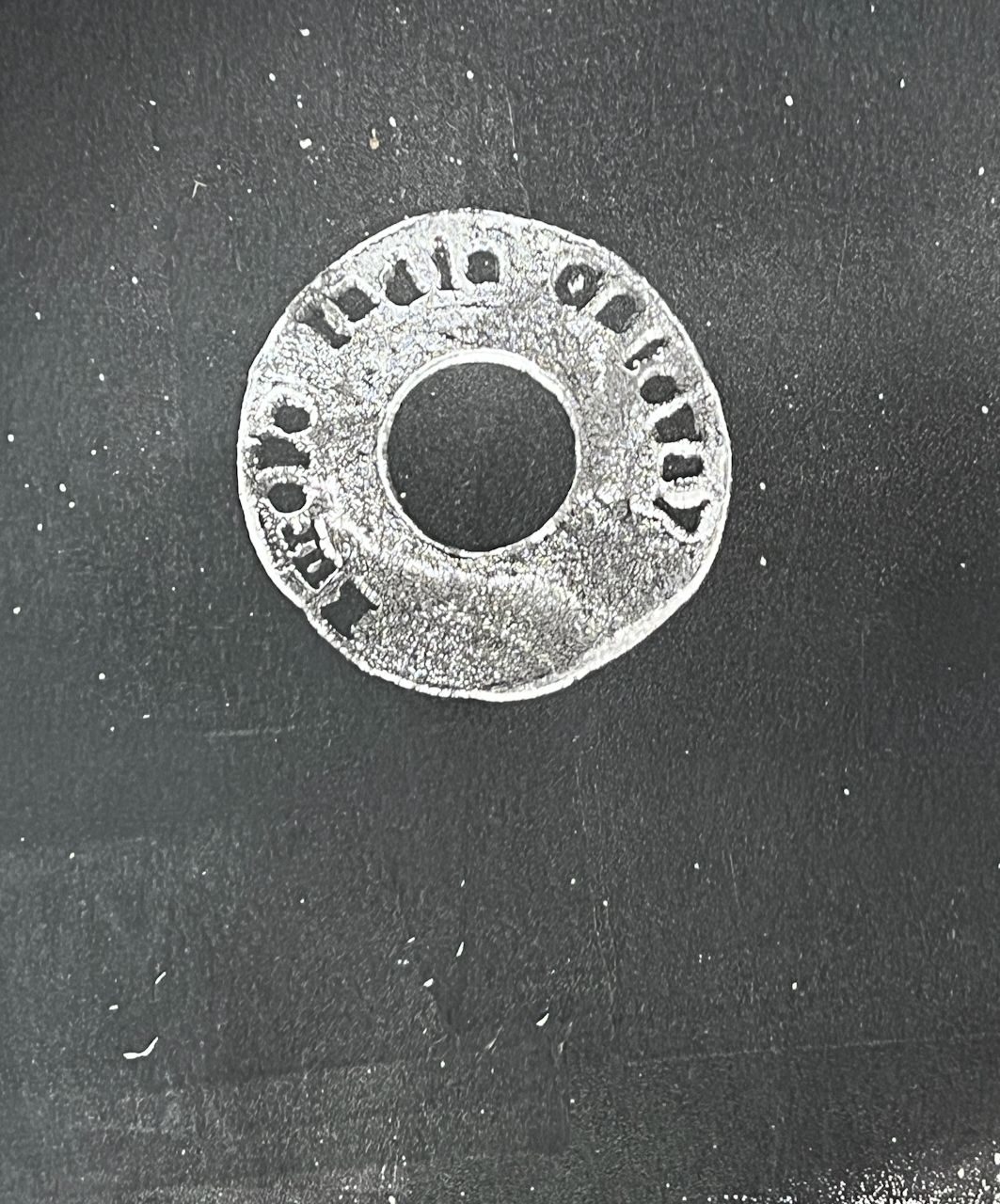 white print on black paper of ring with eastindia gateway written