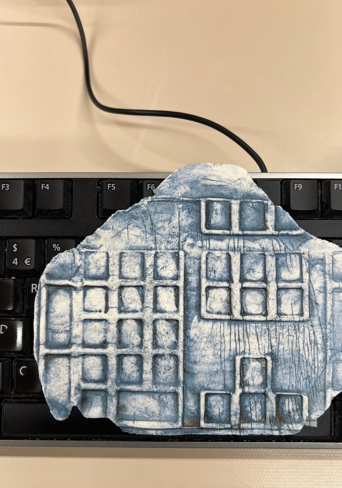 keyboard with ceramic impression of a keyboard on top