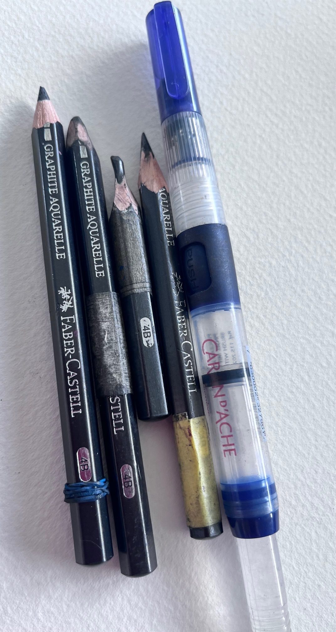 Pencil, brush with reservoir, paper