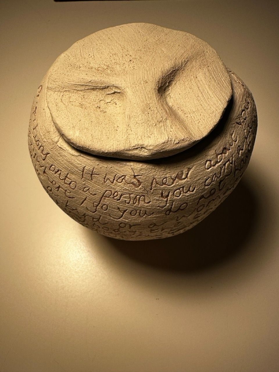 ceramic pot with engraved writing